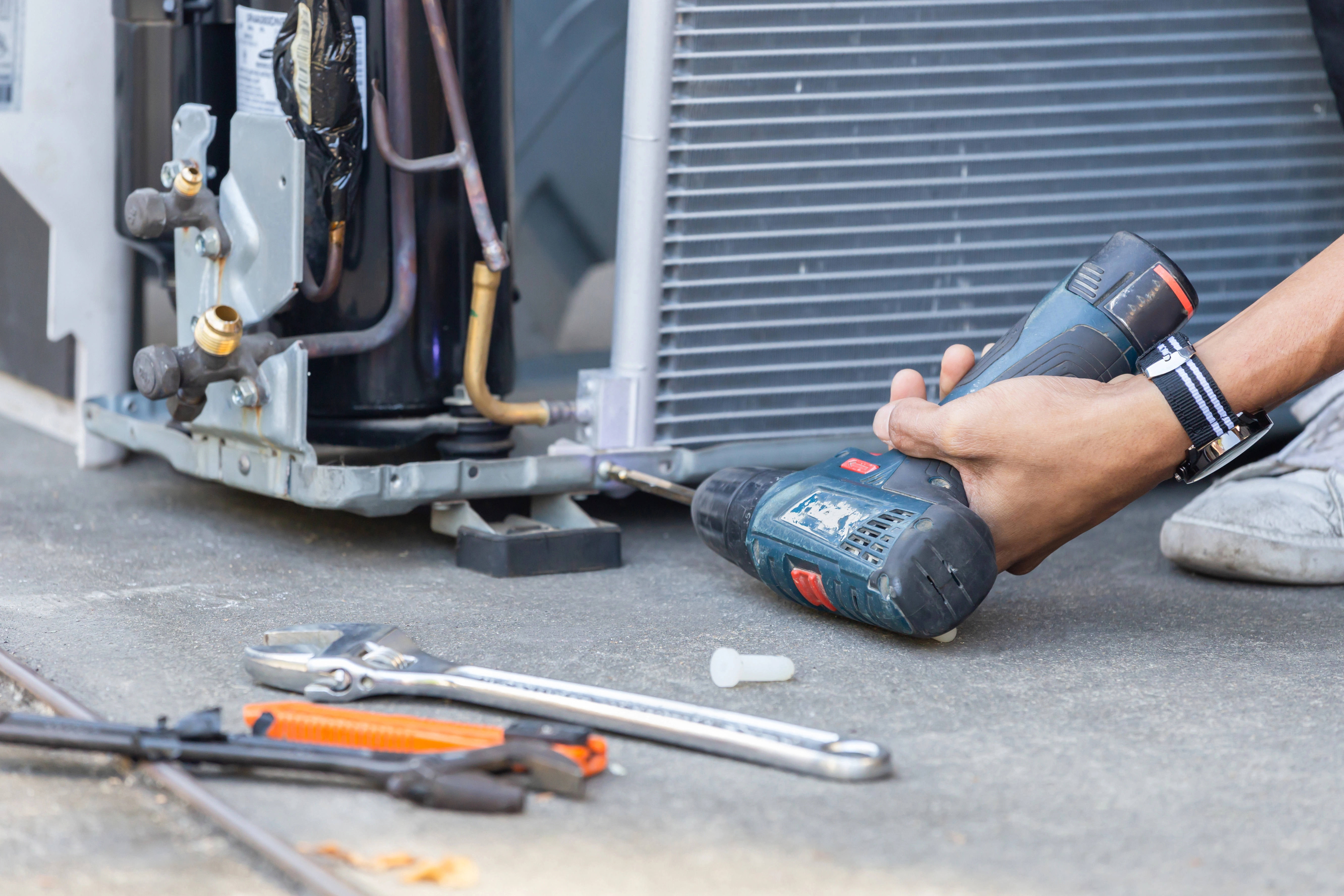 Air Dynamics of Tulsa technician performing a professional HVAC system repair.